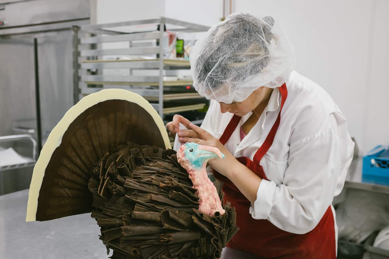Emily McCracken in the factory working on a 3D chocolate turkey
